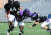 Fayetteville junior Dylan Hale (15) reaches to fend off senior outside linebacker Bentley Banister (7) during the Dogs' scrimmage Saturday at Harmon Field. 