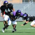 Fayetteville junior Dylan Hale (15) reaches to fend off senior outside linebacker Bentley Banister (...