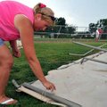 <b>After the storm</b>
Deb Sherman of Bentonville picked up her tent after it took down the side fe...