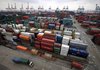 Numerous shipping containers sit stacked at the Waigaoqiao Container Port in Shanghai, China, in March.