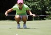 Emma Lavy of Fayetteville lines up her putt on the 1st during the second day of play during the AJGA Arkansas Junior.