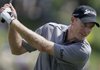 Jim Furyk chats while loosening up on the driving range during a practice round for the 91st PGA Championship at the Hazeltine National Golf Club in Chaska, Minn., Wednesday, Aug. 12, 2009. 