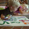 Grace Gheen, 5, right, and her brother Jack Gheen, 2, color posters supporting the Campaign for A St...