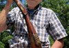 Michael "Hawkeye" Pierce of Eureka Springs displays the antique rifle black-powder rifle that launched his gun-collecting career as a youngster. The rifle was given to him by famed gun collector Col. C.B. Saunders of Berryville.


