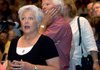 Nancy Emmons from Hot Springs Village asks U.S. Rep. Mike Ross, D-Ark., a question Friday during a health-care meeting in Arkadelphia.