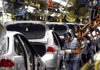 Workers assemble Ford Focuses in May 2008 as they roll down the line at a Ford stamping and assembly plant in Wayne, Mich.