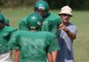 Greenland coach Tracy Sutton directs his linemen on positions during practice Wednesday at the school's practice field in Greenland.