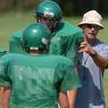 Greenland coach Tracy Sutton directs his linemen on positions during practice Wednesday at the schoo...