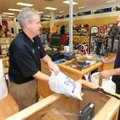 <b>New golf shop</b>
Chris Knodle, left, co-owner of Golf USA, located at 3184 N. College Ave. Suit...