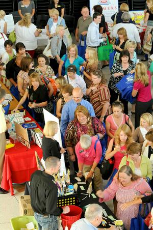 Bentonville School District teachers and staff crowded into the Bentonville High School North Building for the districts annual Teachers Fair on Friday.