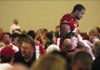 Arkansas tight end D.J. Williams signs autographs during the 2009 Arkansas Razorback Football Kickoff Luncheon Friday at the Northwest Arkansas Convention Center in Springdale.  The Razorbacks' season begins Sept. 5 against Missouri State in Little Rock.