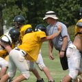 Prairie Grove head coach Danny Abshier works with his linemen during practice Aug. 6 in Prairie Grov...