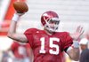 Arkansas sophomore quarterback Ryan Mallett warms up before practice Saturday at Razorback Stadium in Fayetteville.