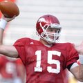 Arkansas sophomore quarterback Ryan Mallett warms up before practice Saturday at Razorback Stadium i...