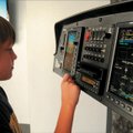 Yound aviator:  Matthew Hutchins, 12, operated the control panel from a Cessna G300 airplane during ...