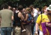 Participants in the Great Nationwide Kiss-In smooch Saturday in front of the Fayetteville Town Center.  The event is an effort to raise awareness of continuing discrimination against same-sex couples.