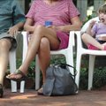 Sittin' at the social:  Kimberly Gordon, 3, of Fayetteville eats ice cream alongside her grandparent...