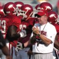 Arkansas head coach Bobby Petrino helps pumps up the team during practice Saturday at Razorback Stad...