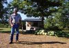 George Thomas runs a produce stand on Arkansas 74 near Wesley in Madison County, one of at least two produce stands in east Madison County operating on the honor system.