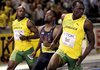 Jamaica's Usain Bolt (right) crosses the finish line to win the men's 100 meters in a world record time of 9.58 seconds. Former Arkansas Razorback Tyson Gay (center) was second and Jamaica's Asafa Powell third.