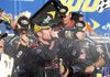 Brian Vickers (center) celebrates with his pit crew Saturday after winning the NASCAR Sprint Cup Series Carfax 400.