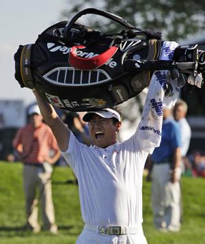 Y.E. Yang celebrates after upsetting Tiger Woods on Sunday to win the 91st PGA Championship at the Hazeltine National Golf Club in Chaska, Minn. It was Yang's first victory in a major and only his second on the PGA Tour.