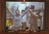 Iranian judge Abolqasem Salavati (bottom left) watches an image of protesters during Iran's post-election
turmoil at the Revolutionary Court in Tehran, Iran, on Sunday.