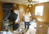 Deborah Stark, who says she's been off methamphetamine for five months, stands in her mobile home off Caney Creek near Lake Conway.