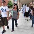 Bentonville freshman Tristan Vaughan, 14, of Bentonville walked from the South Building to the North...