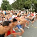 Runners left the finish line at South Fifth Street in Rogers on Monday night for the inaugural Roger...