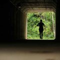 <b>Into the light</b>
A runner makes his way beneath Gregg Avenue while following the Scull Creek T...