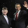 President Barack Obama is greeted Monday by Glen Gardner, the commander and chief of the VFW, after ...