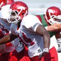 Arkansas sophomore linebacker Jerry Franklin (34) runs through punting drills during practice Tuesda...