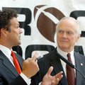 Little Rock Touchdown Club President David Bazzel (left) talks with Metropolitan National Bank Presi...