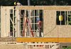 Workers frame a house in the Briar Chapel community near Chapel Hill, N.C., on Monday.