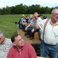 Herman Jones, a local farmer, right, tells U.S. Rep. John Boozman, center, and other visitors with t...