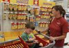 Taylor Baker, 4, and his mother, Meagan Baker, of Bella Vista shop for back-to-school supplies Tuesday at Target in Rogers.