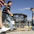 Springdale High School students walk Wednesday between school buildings on what that used to be Emma...