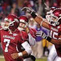 Arkansas kicker Alex Tejada (7) and tight end D.J. Williams (45) celebrate Tejada's extra-point kick...