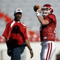 Quarterbacks coach Garrick McGee (left) coaches Arkansas quarterback Ryan Mallett during a summer pr...