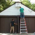 <b>Museum maintenance</b>
Ryan Cummings, left, and Ashden White paint the garage at the Clinton Hou...