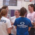 Fayetteville volleyball coach Jessica Phelan chats with some of her players before a scrimmage at pr...