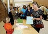 Lois Hussain (left), a special-education administrator, instructs Meghan Flowers, a teacher, before job interviews in Detroit.