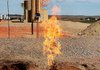 Natural gas flares from an oil well last September near Parshall, N.D.