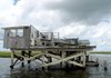 Destroyed cabins are still common sights along the bayous of the Louisiana Delta south of New Orleans nearly four years after Hurricane Katrina pounded the area.