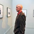 Steve Cooper of Fayetteville looked at one of the 30 photographs by Harry Lewis Miller during the op...