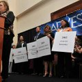 Twenty-five graduates stood behind Donna Powers, left, of Springdale, a past recipient of a Single P...