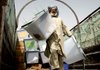 A worker unloads ballot boxes from Afghanistan's presidential election Friday in the Kandahar province.