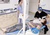 Dr. Alberto Meza, a dentist, applies cosmetic veneers on Alison Battle at Meza Dental Care in San Jose, Costa Rica.