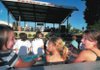Kamryn Lawson, 10 left; Ciera Lawson, 3; and Bailey Reed, 10, with Cocoa, a teacup Chihuahua, reacted with a scream to a song being performed by Sarah Brown and the Neighborhood during the Twilight Walk Dog Days of Summer event in downtown Rogers on Friday evening.